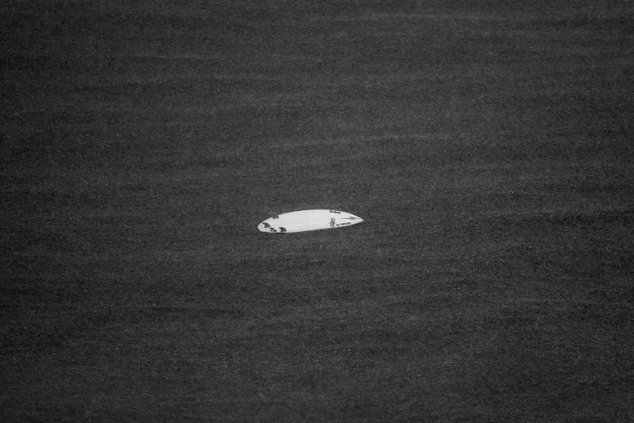 Board adrift, black and white